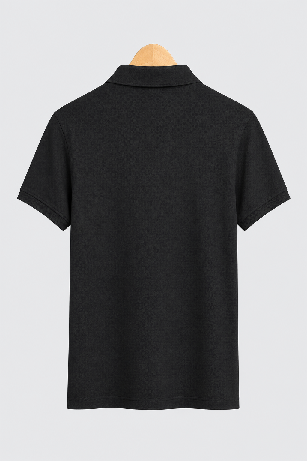 Polo Tommy Hilfiger noir Slim Fit, vue de dos sur fond clair