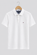 Polo Tommy Hilfiger blanc Slim Fit de face sur fond clair