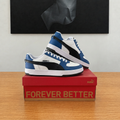 Puma Caven 2.0 VTG blanc bleu noir, photo de profil recentrée